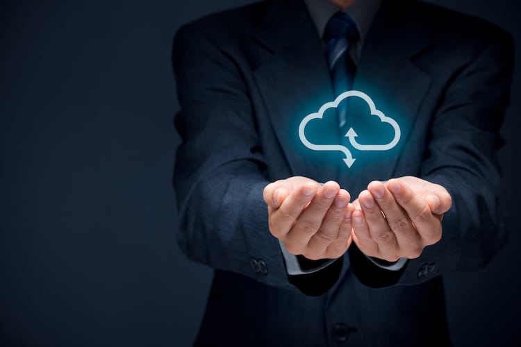 businessman holding a cloud computing icon